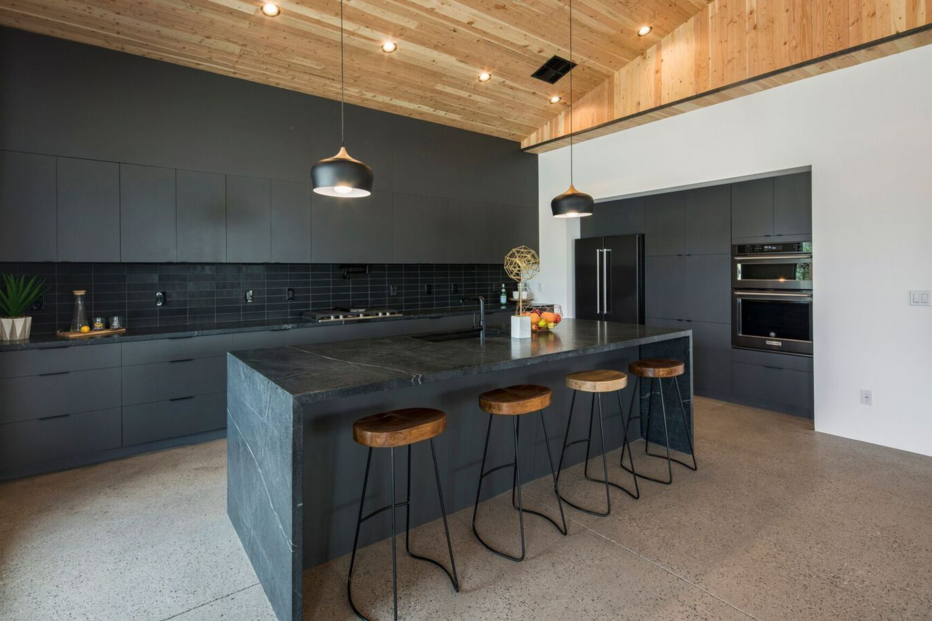 Modern open concept kitchen with dark features in Phoenix, AZ