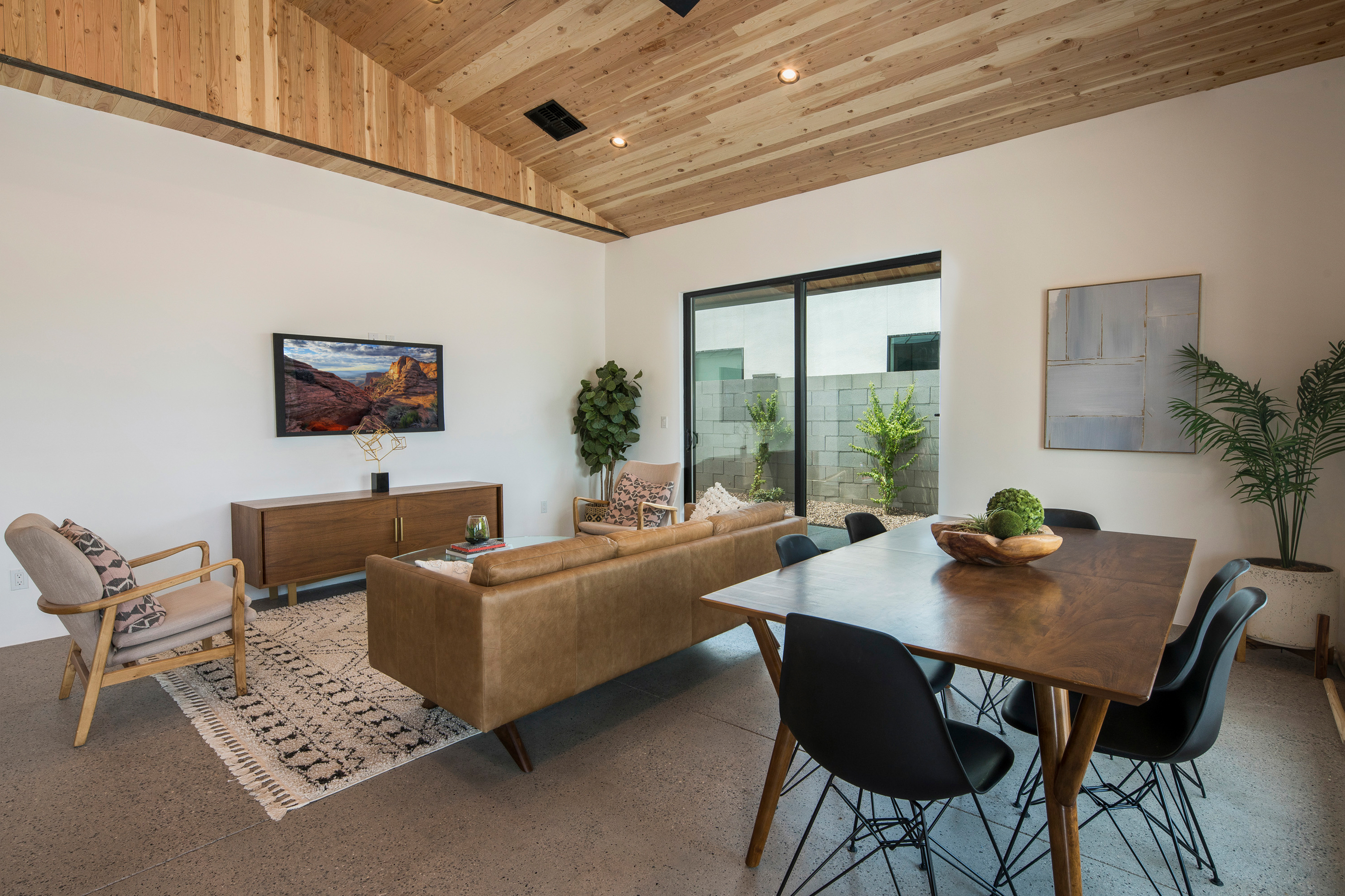 livingroom with wood clad vaulted ceilings